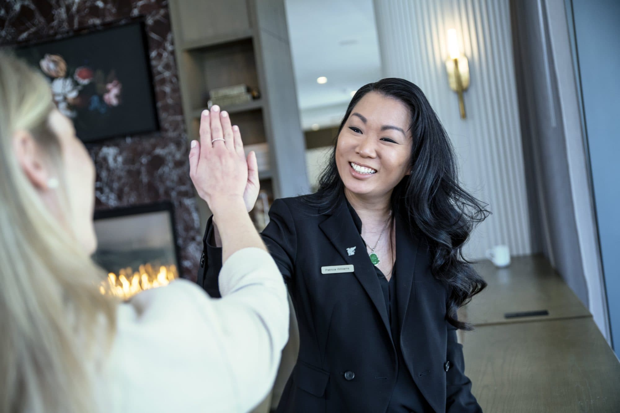 Two women high-five
